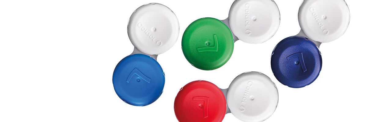 Färgade linsetuier i rad